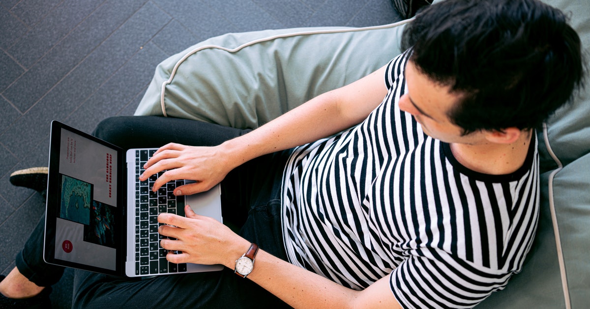 Man typing on laptop