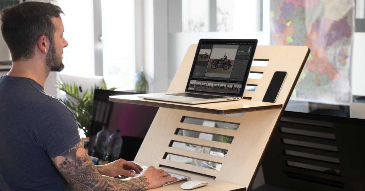 Man using a laptop stand