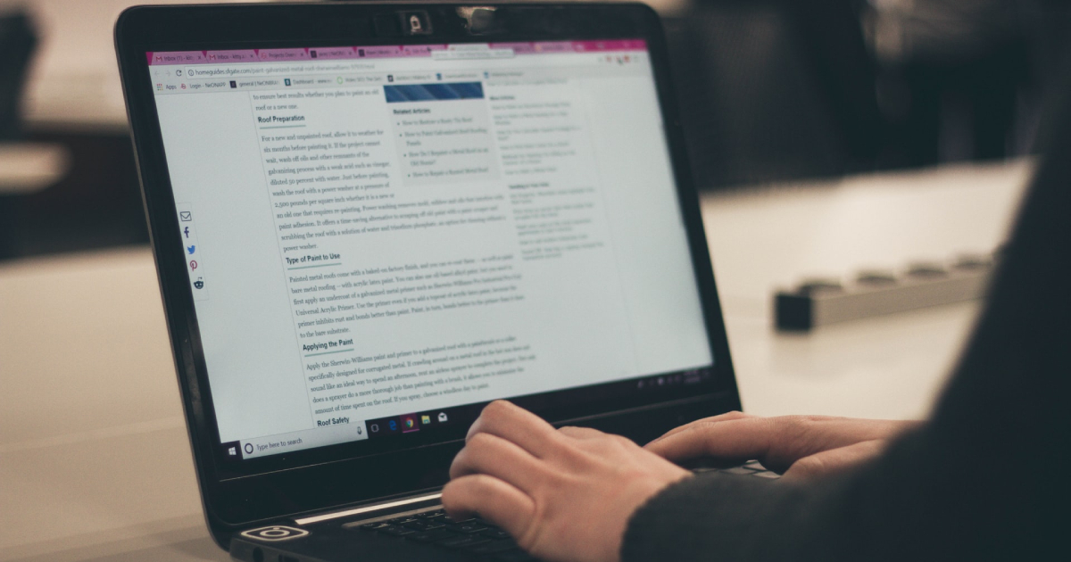 Woman typing on laptop keyboard