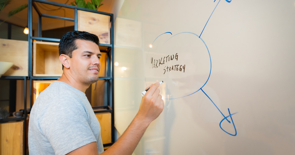 Man writing on whiteboard